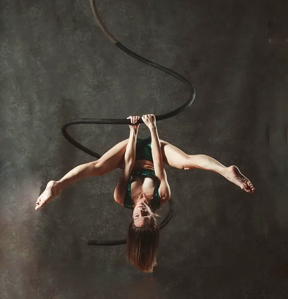 Aerial spiral pole performance photograph from The Aerial Illusions Company